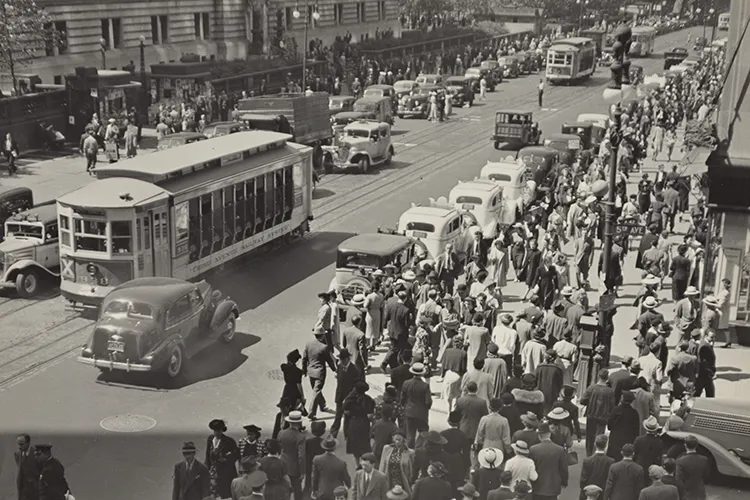 Old photo of people walking in the city